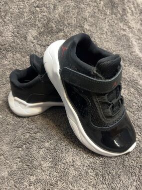 Nike Kids Black and White Sneakers with Red Jumpman Accent